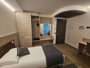 Voodi või voodid majutusasutuse Mito Hotel toas