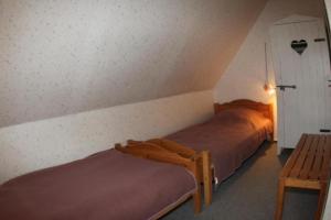 Una cama o camas en una habitación de Ferienhaus Meerblick - einmalige Lage, direkt an der Ostsee