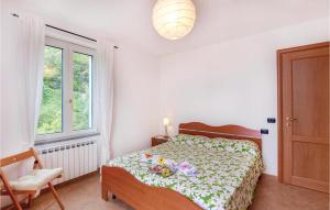 Posteľ alebo postele v izbe v ubytovaní Cozy Apartment In Localitabracco Ge