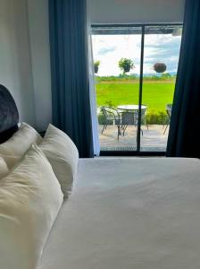 Postel nebo postele na pokoji v ubytování Paddy Villea Inn SPT Penang