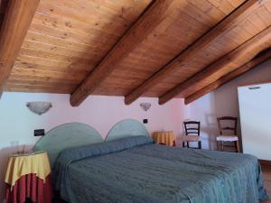 Postel nebo postele na pokoji v ubytování Agriturismo Cà Trinche