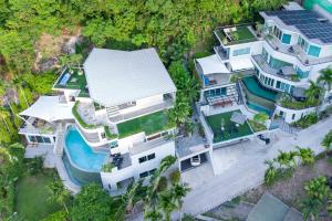 an aerial view of a house with a swimming pool at Villa Beyond-Namaste 16 Bedroom Fully Staffed Seaview Villa in Ban Thalat Choeng Thale
