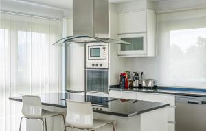 A kitchen or kitchenette at Awesome Home In Noia With Wifi