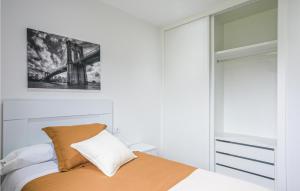 A bed or beds in a room at Awesome Home In Noia With Wifi