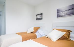 A bed or beds in a room at Awesome Home In Noia With Wifi