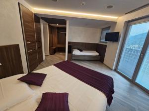 Voodi või voodid majutusasutuse Mito Hotel toas