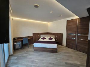 Voodi või voodid majutusasutuse Mito Hotel toas