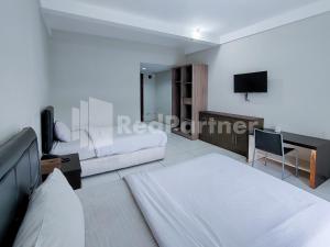 TV a/nebo společenská místnost v ubytování Grand Pujon View Hotel And Resort Mitra RedDoorz