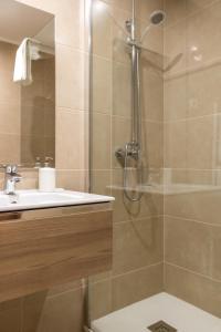 a bathroom with a shower and a sink at Torralta Apartment in Alvor