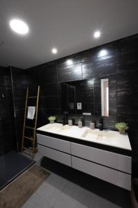 a bathroom with a white sink and a mirror at Casas349h Alicante City Centre Trafalgar in Alicante