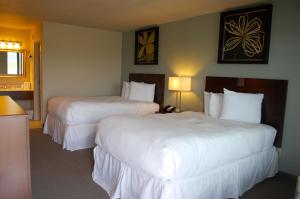 Postel nebo postele na pokoji v ubytování Unique Suites Hotel