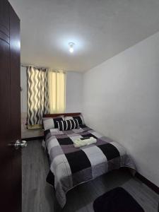 Ένα ή περισσότερα κρεβάτια σε δωμάτιο στο JM's Inn Lapu-lapu City