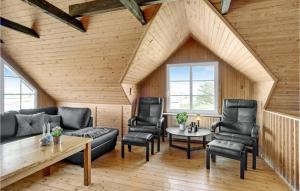 a living room with a couch and chairs and a table at 3 Bedroom Cozy Home In Fjerritslev in Fjerritslev