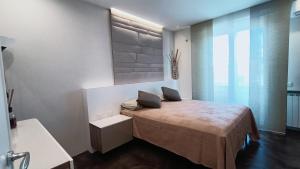 Ένα ή περισσότερα κρεβάτια σε δωμάτιο στο Casa Mazzini -LUXURY STAY-