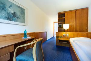 Postel nebo postele na pokoji v ubytování Roomingtons Karoli Waldkirchen