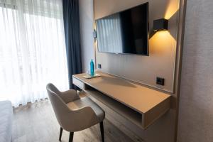 TV a/nebo společenská místnost v ubytování Roomingtons Karoli Waldkirchen