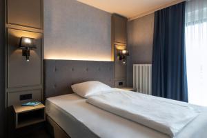 Postel nebo postele na pokoji v ubytování Roomingtons Karoli Waldkirchen