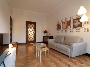a living room with a couch and a table at Uporto House Villa in Porto