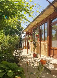 a patio of a house with a greenhouse at Casa Nautica in Jurilovca +21 photos