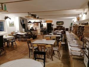 a restaurant with tables and chairs in a room at Novomanželský apartmán - 100DOLA in Lanškroun