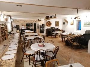 a restaurant with tables and chairs in a room at Novomanželský apartmán - 100DOLA in Lanškroun +7 photos