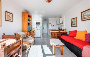 a living room with two couches and a kitchen at Amazing Apartment In Torremolinos in Torremolinos