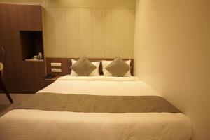 Letto o letti in una camera di A Square Executive Hotel