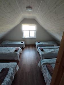 a room with six beds in a attic at Sepa puhkemaja in Pärnu +29 photos