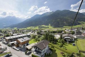 a view of a town with mountains in the background at Residenz Wildkogelbahnen Top 7 in Neukirchen am Großvenediger