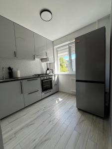 Kuchyň nebo kuchyňský kout v ubytování Home Sweet Home Self Check - in + 17 fotografií