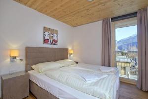 Postel nebo postele na pokoji v ubytování Residenz Wildkogelbahnen Top 21