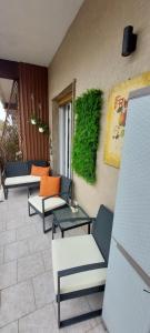 a group of chairs and tables on a patio at Visconti 46 Central Apartments in Bari