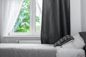 Łóżko lub łóżka w pokoju w obiekcie Ośrodek Wypoczynkowy Leśne Ustronie