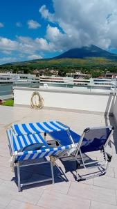 a blue and white chair sitting on a roof at Casa di Nonna Margherita in Trecase