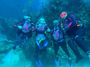 a group of people in snorkelling gear in the ocean at Golden Palms Beach Resort Inhambane Bay Mozambique in Cabo Guinjata