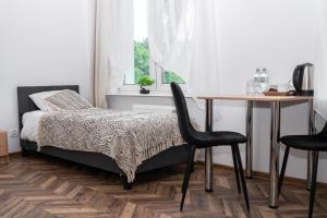Łóżko lub łóżka w pokoju w obiekcie Ośrodek Wypoczynkowy Leśne Ustronie