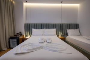 Postel nebo postele na pokoji v ubytování Hotel Siars