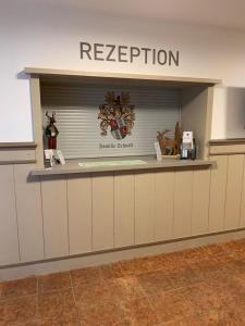 a store with a registration sign on a counter at Haus Schnöll Top 6 in Mittersill
