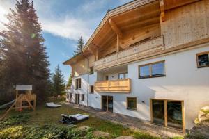 a house under construction with a wooden roof at Chalet Zillertal Arena 1 in Kirchdorf