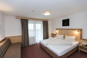 Posteľ alebo postele v izbe v ubytovaní Hotel Garni Ehrenreich