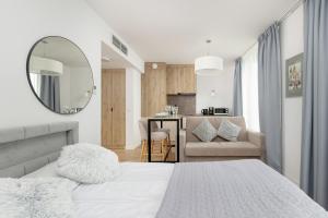 Ένα ή περισσότερα κρεβάτια σε δωμάτιο στο Apartamenty Jantaris II by Noclegi Renters +152 φωτογραφίες