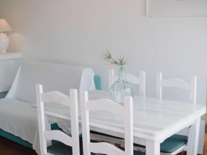 Postel nebo postele na pokoji v ubytování Hostal del Cabo