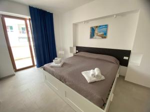 Postel nebo postele na pokoji v ubytování Manfredi Sea Room