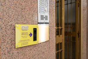 a sign on the side of a building next to a door at Rome Ciampino Smart Hotel in Ciampino