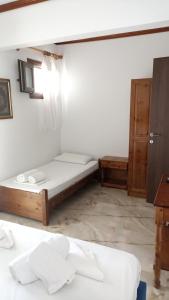 Postel nebo postele na pokoji v ubytování Villa Karapataki