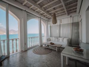 a living room with a view of the ocean at Villa Singular in San José