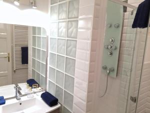 a bathroom with a shower and a sink at Hello Downtown Apartment - Eiffel in Budapest