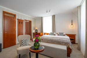 Postel nebo postele na pokoji v ubytování Kotnik Superior Boutique Hotel