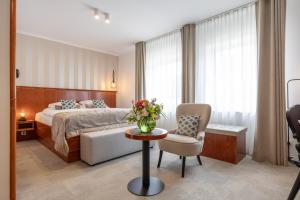 Postel nebo postele na pokoji v ubytování Kotnik Superior Boutique Hotel
