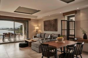 A seating area at Beachfront Alassa Villas with Private Pools